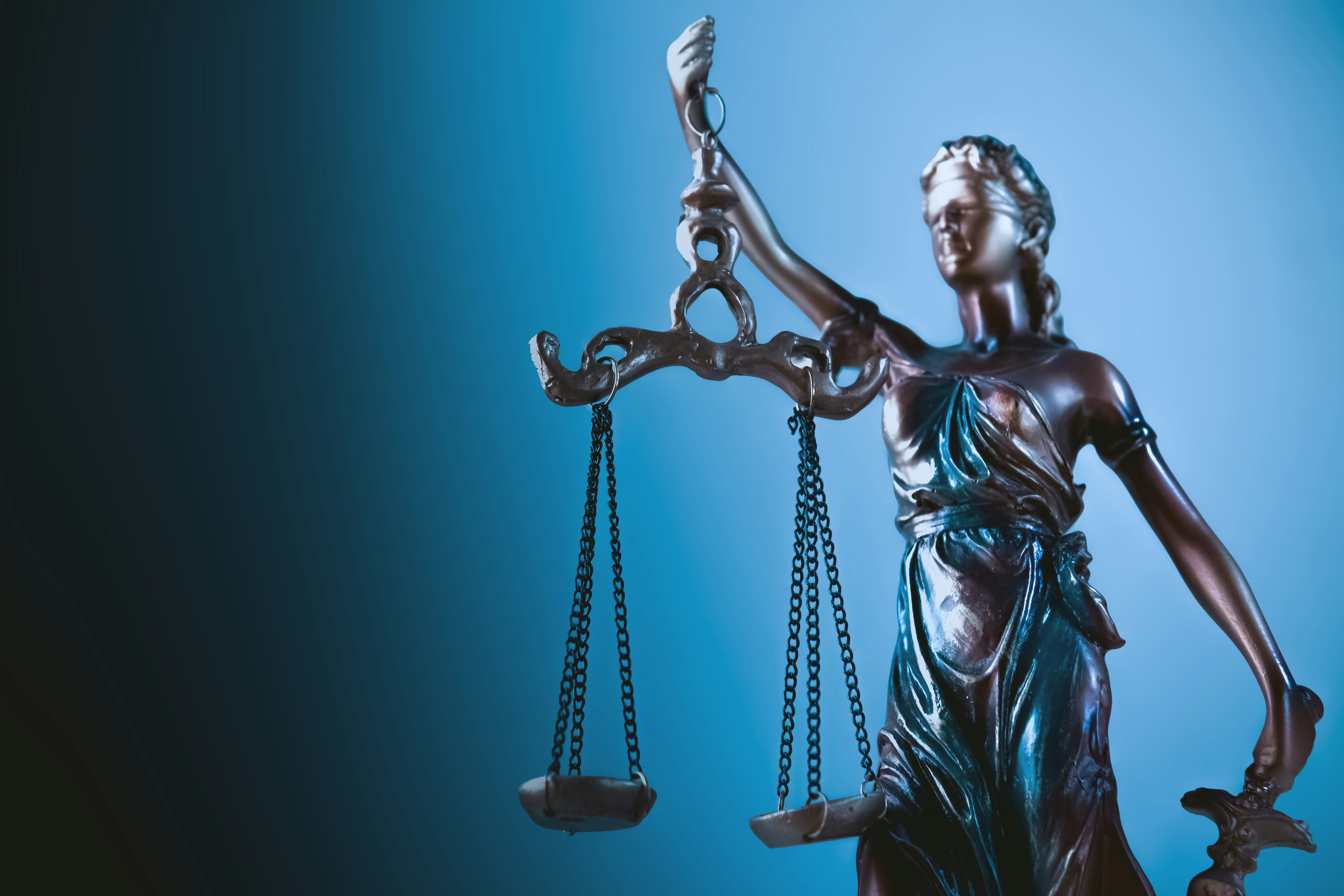 Statue of justice holding scales